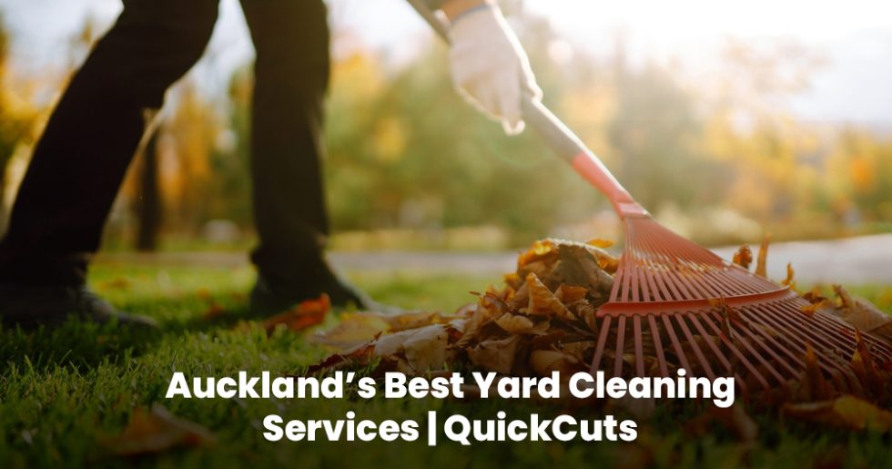 Person raking fallen leaves during yard cleaning service in Auckland by QuickCuts.