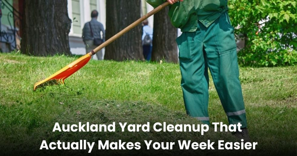 Worker raking grass during yard cleanup in Auckland to keep lawns and gardens neat.