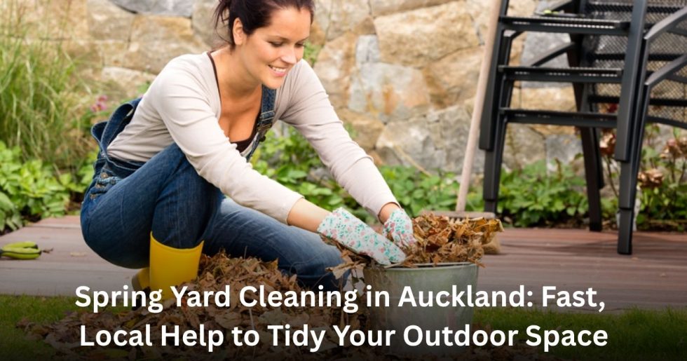 Smiling woman cleaning up dry leaves in her Auckland backyard during spring yard cleanup, surrounded by garden plants and patio furniture.