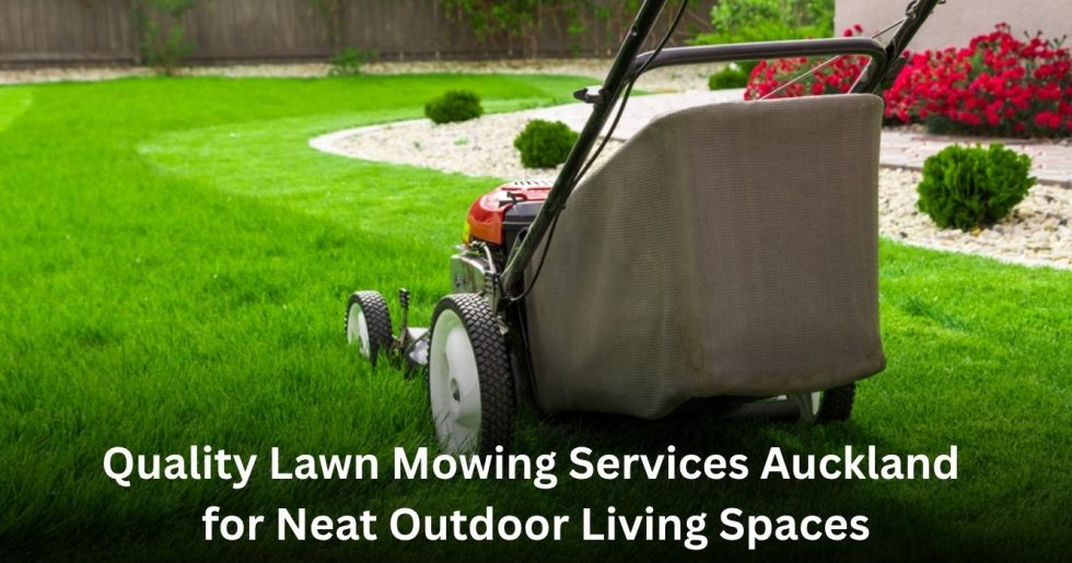 professional lawn mower cutting green grass in a landscaped Auckland garden